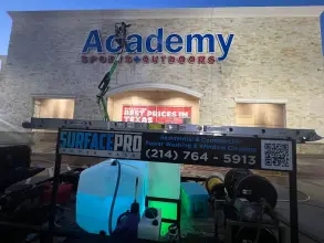 Surface Pro Power Wash cleaning the Academy Sports and Outdoors storefront in Allen, TX