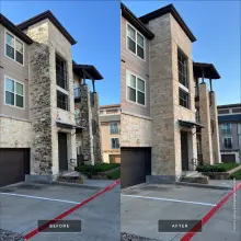 Before and after soft washing of a stone veneer tower on a three story apartment building, black organic staining fully removed in Frisco, TX