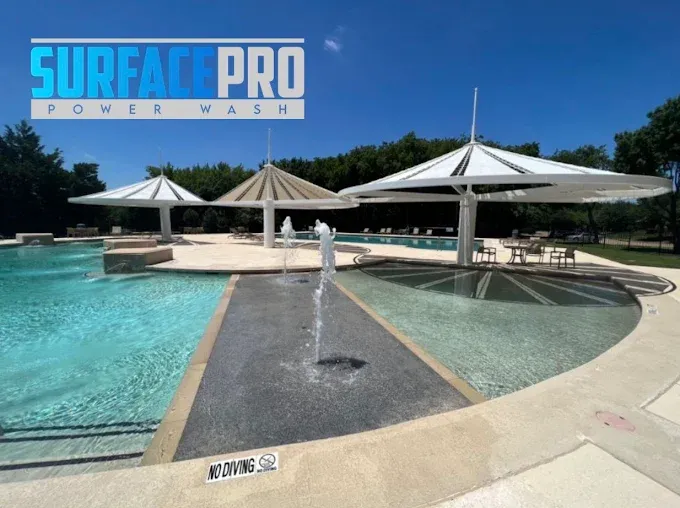 Cleaned community pool deck and splash pad at a property in Frisco, TX