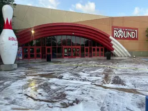 Cleaning solution dwelling on the entrance concrete of a bowling and amusement venue before rinsing