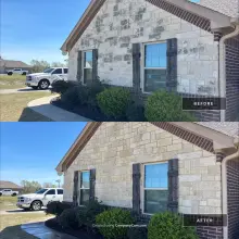Before and after soft wash of a limestone house gable with black organic staining removed in Plano, TX