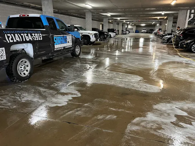 Surface Pro Power Wash truck cleaning a commercial parking garage in Dallas, TX