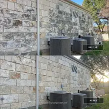 Before and after soft wash of a rear limestone wall with heavy black staining removed near AC units in Plano, TX