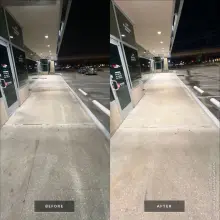 Before and after pressure washing of a shopping center storefront sidewalk, dingy concrete restored to a clean light finish in McKinney, TX