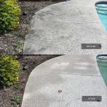 Before and after cleaning of a spray textured concrete pool deck, gray staining removed along the landscape edge in Richardson, TX